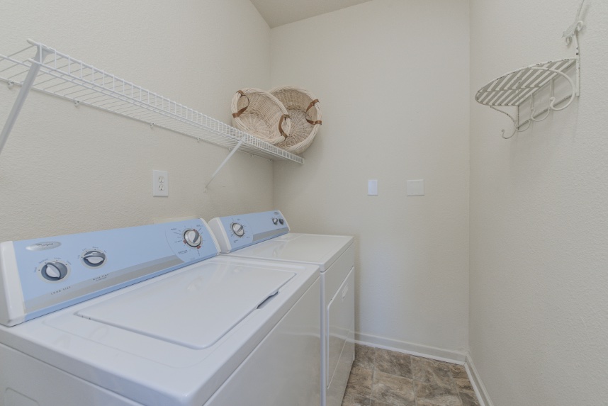Laundry room with storage space in Westfield.